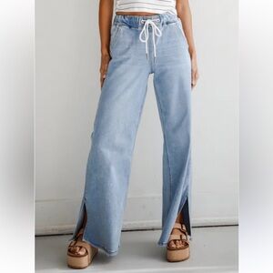 Loverver Light Light Wash High-Rise
Drawstring Waist Wide leg jeans.